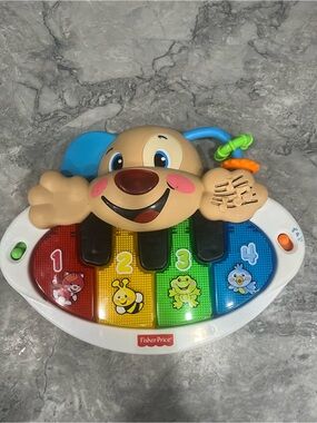 Fisher-Price Musical Puppy Piano Toy 
English and French